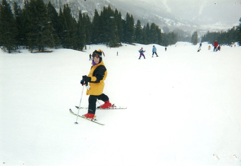 Taylor in the snow, on skis