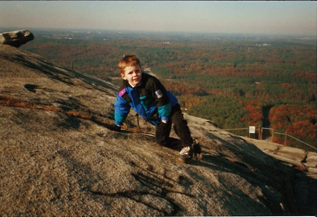 Taylor climbing a mountain