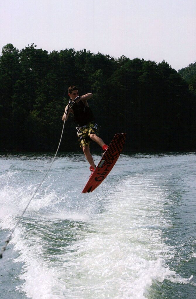 Taylor mid-air, water skiing