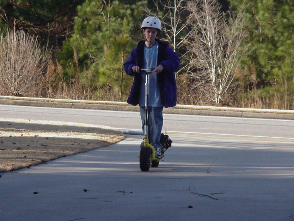 Taylor on a motorized scooter